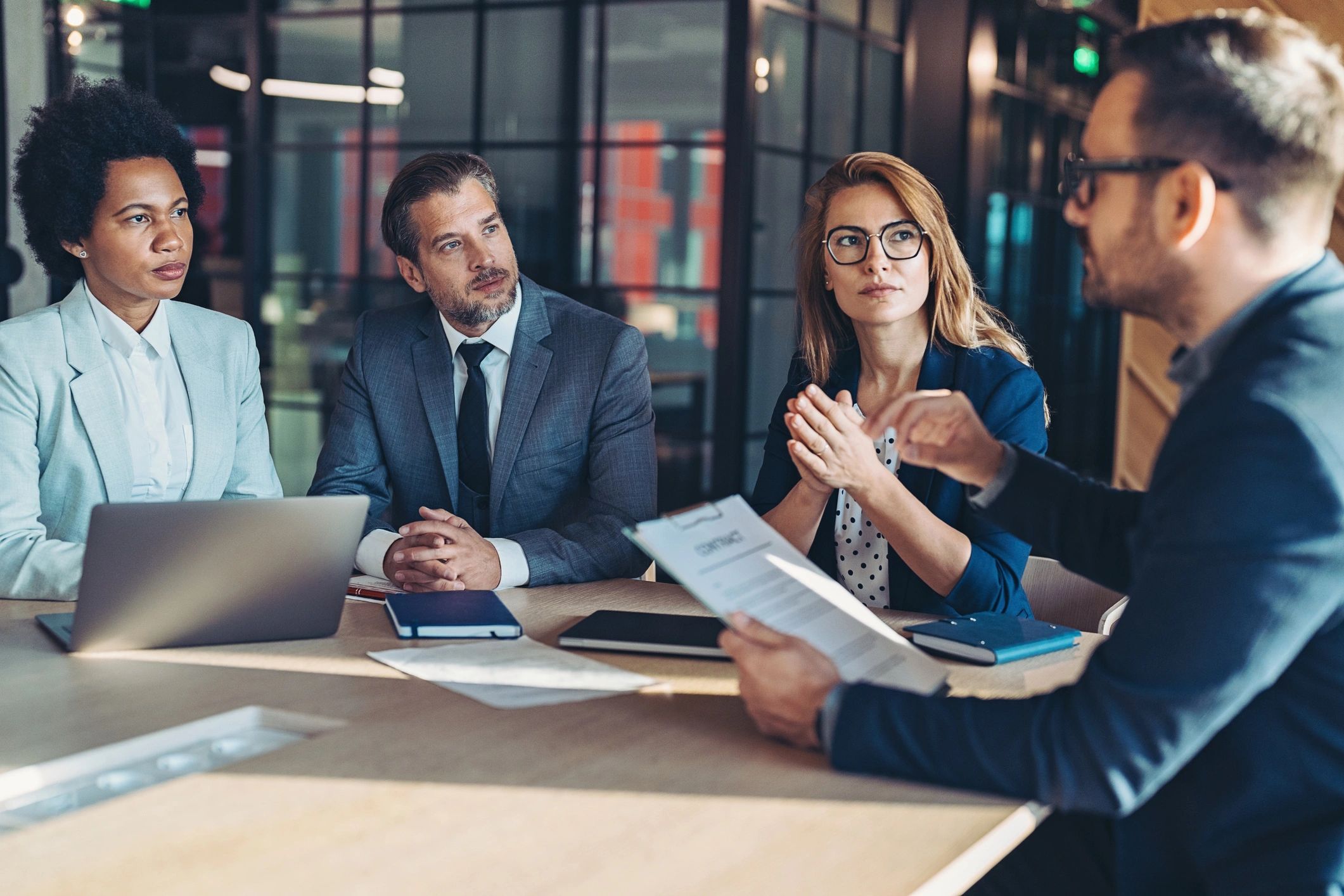 Advisor presenting growth strategy in a business meeting